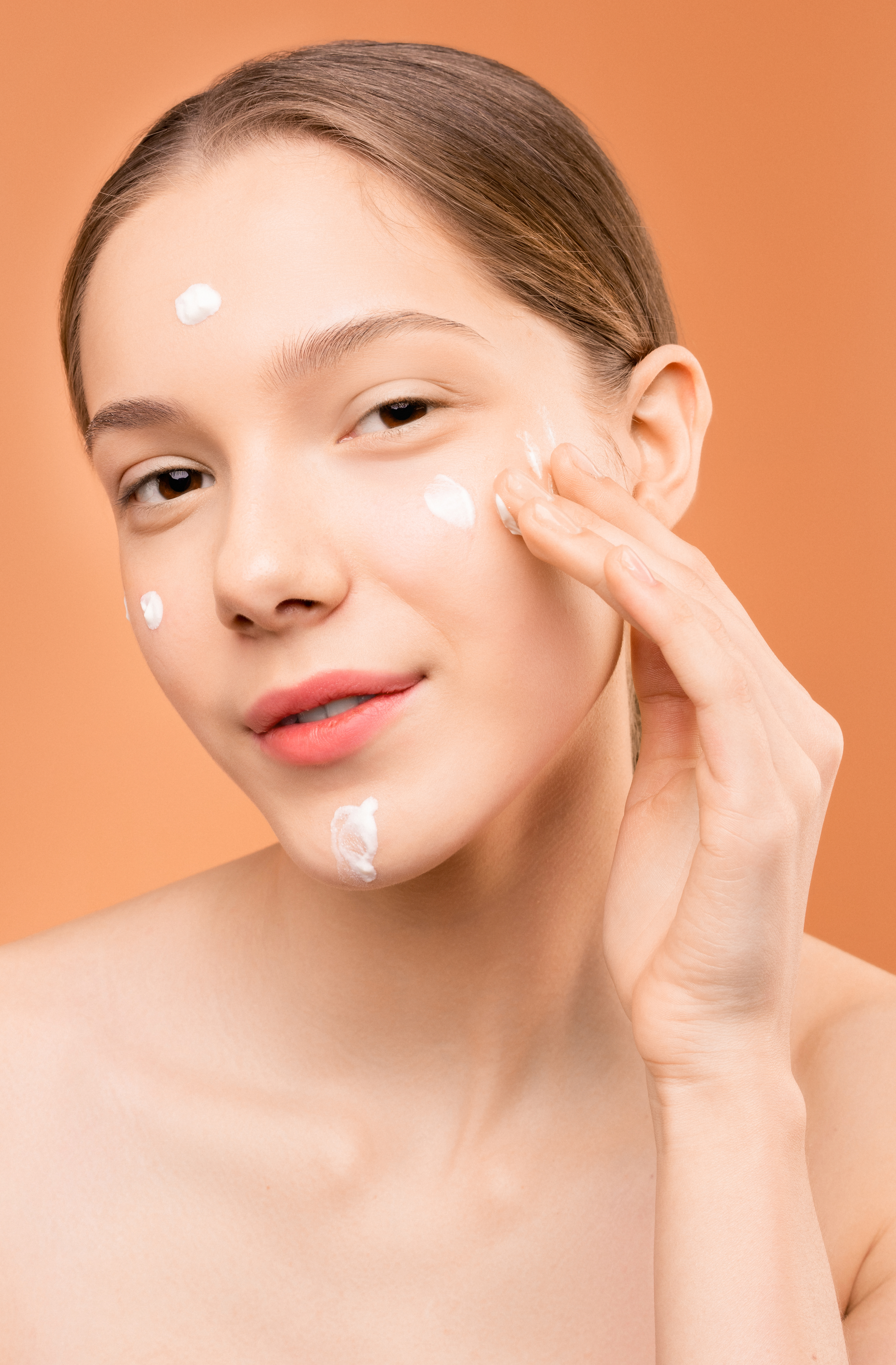Canva Woman Applying Facial Cream On Her Face